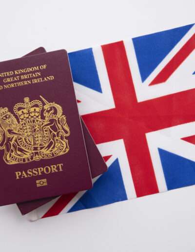 VSMR Visas United Kingdom travel passport on a Great Britain Union Jack flag